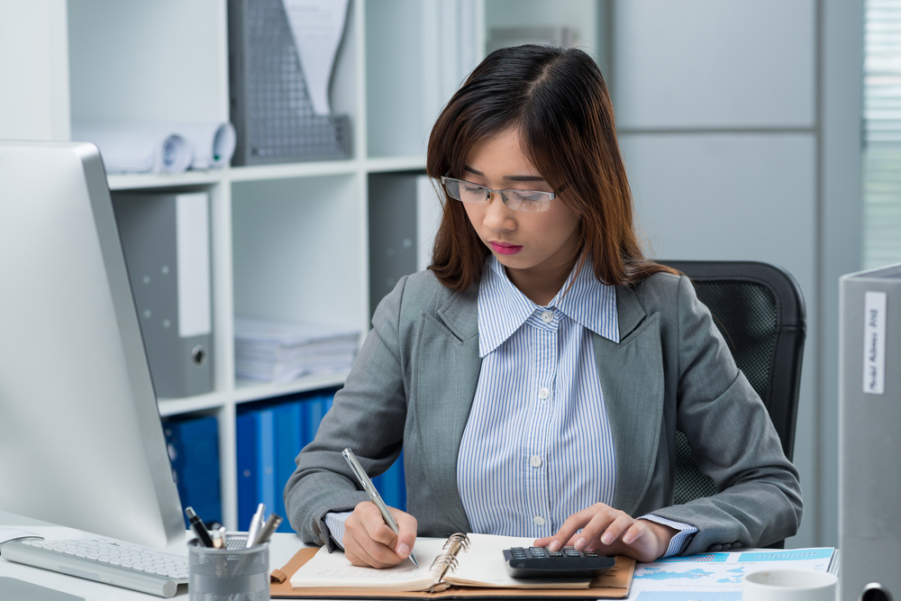 girl taking down notes at work