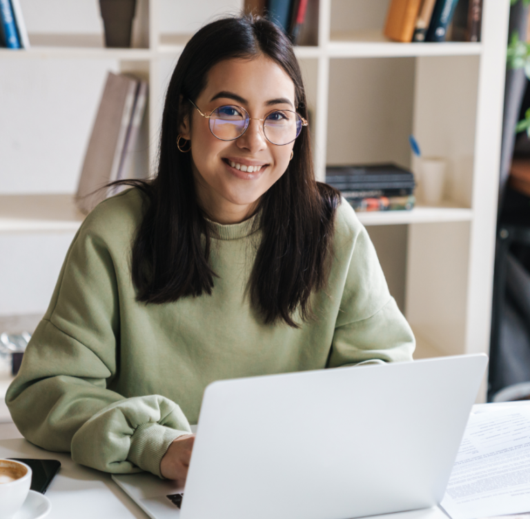 young woman using her laptop