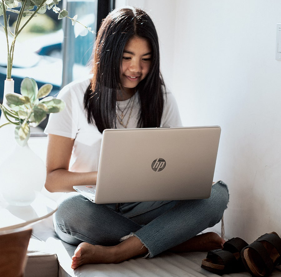 young girl using her laptop