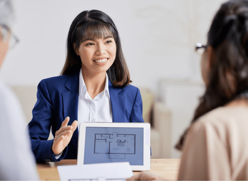 real estate manager showing a property to a couple