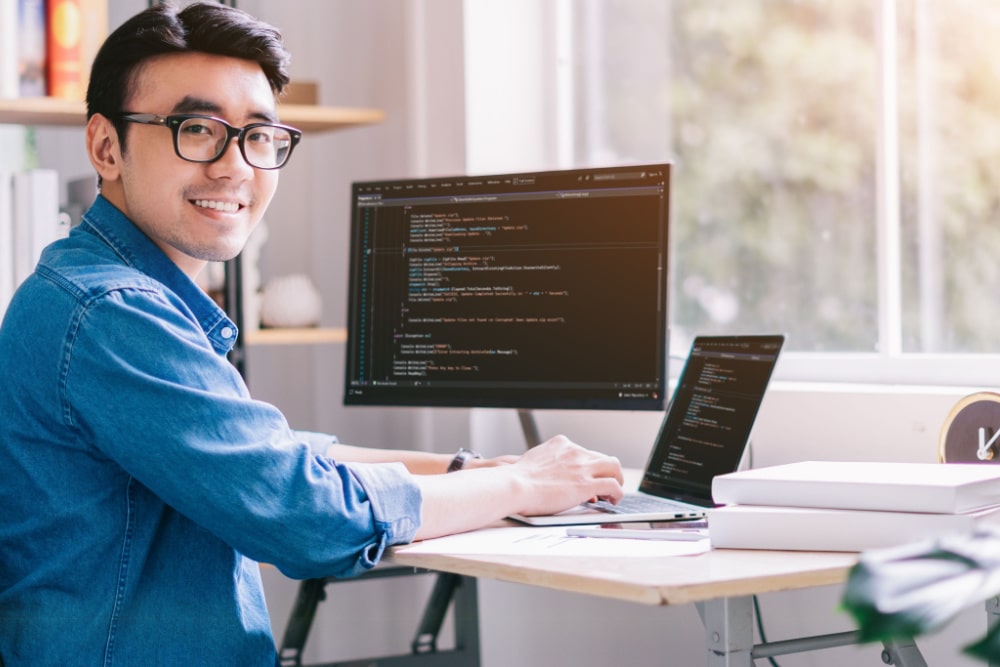 computer programmer smiling