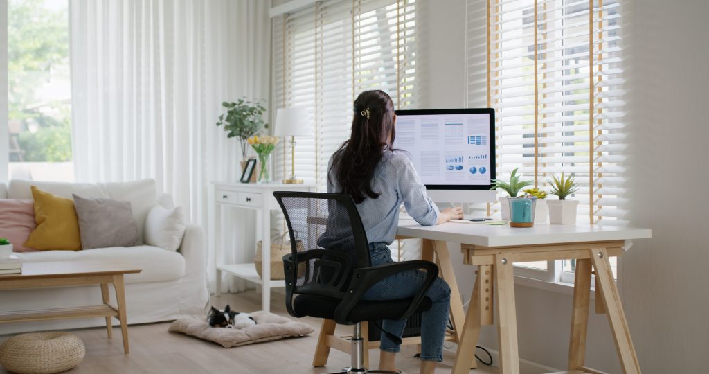 a woman looking at graphs on her computer