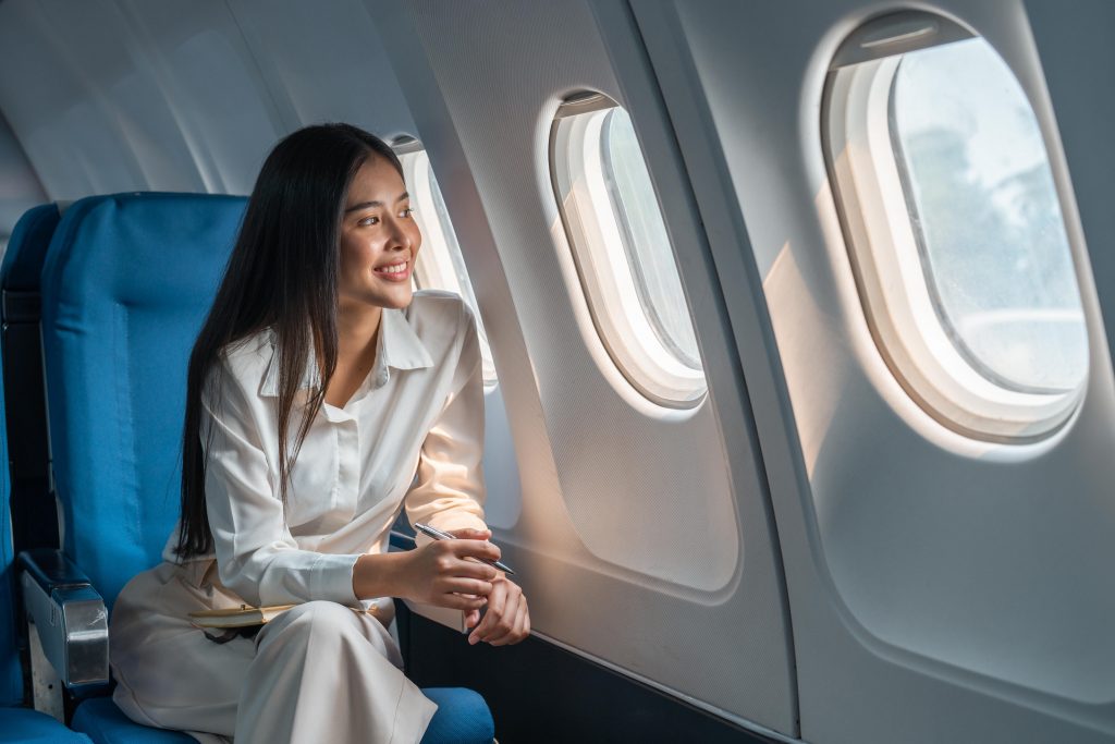 a travel agent sitting on a plane