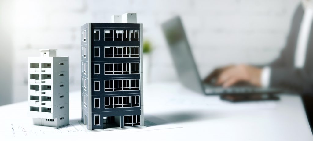 a real estate broker working on his laptop