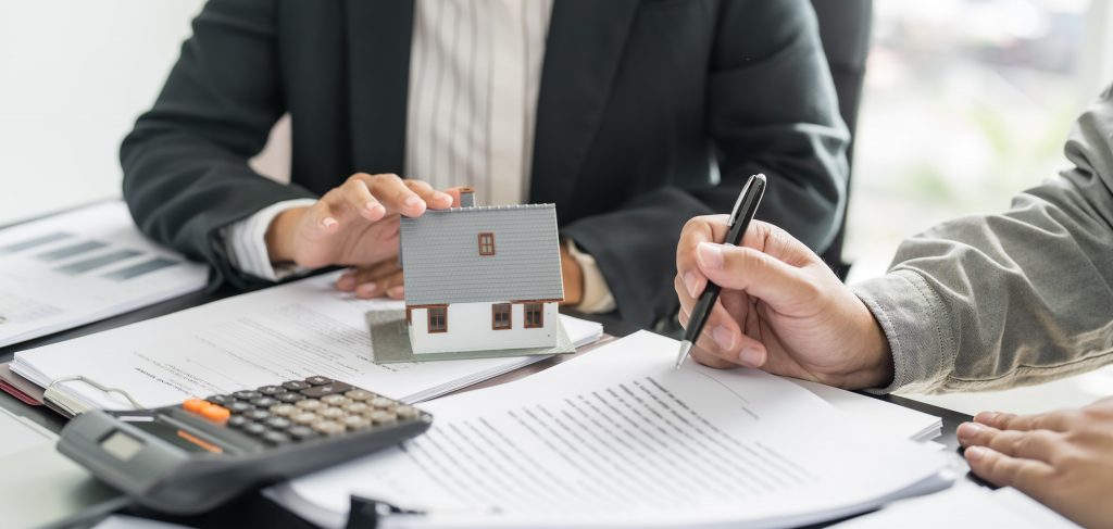 two real estate agent reading a contract