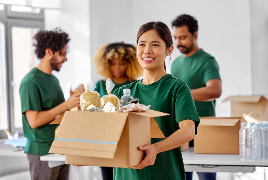 a woman holding a food supply