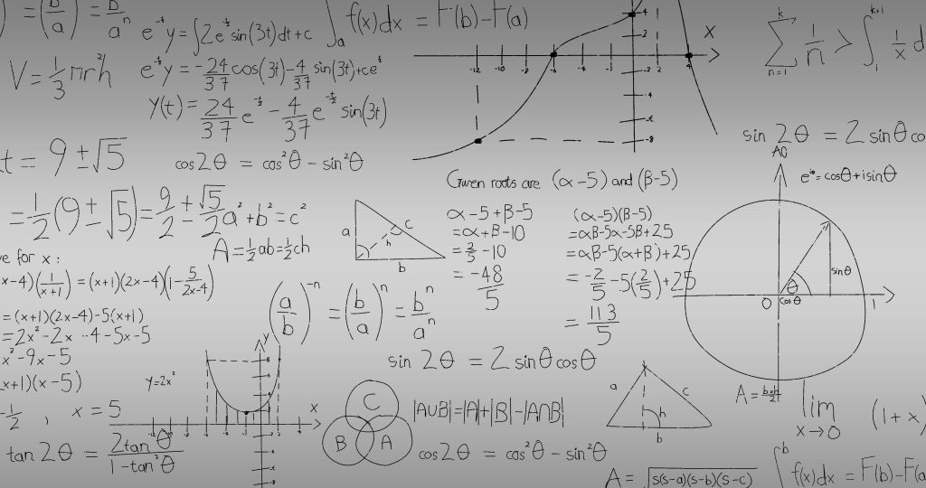 mathematical formulas and computations written on a white board